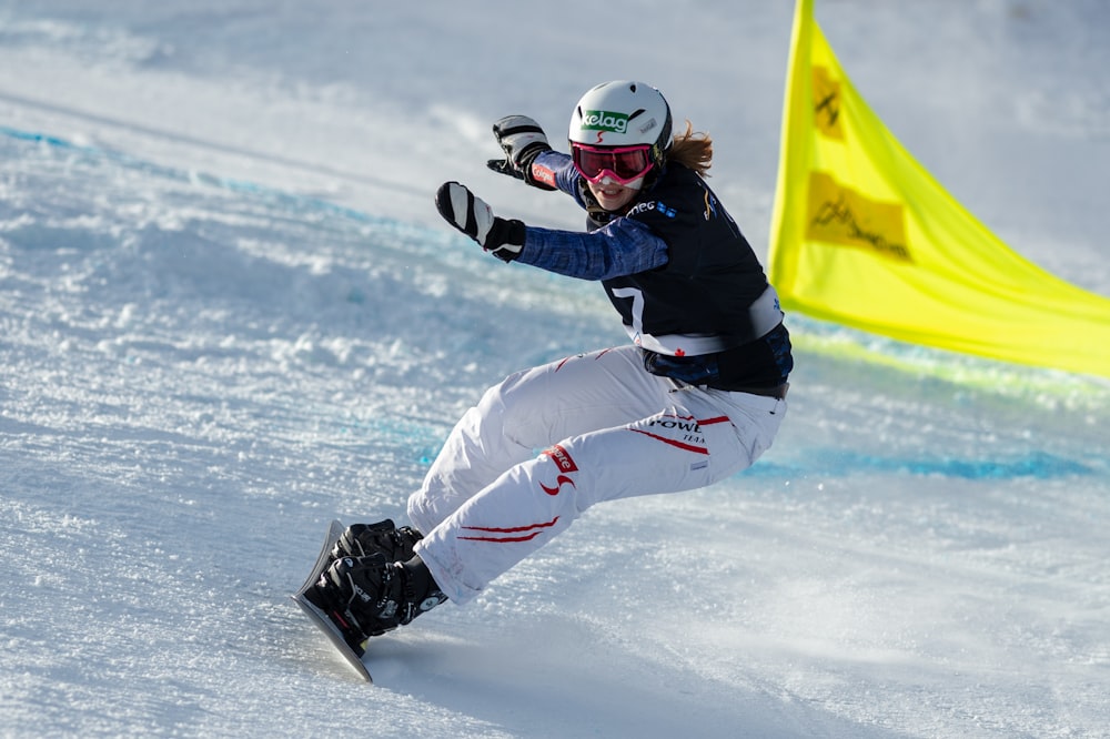 man riding snowboard