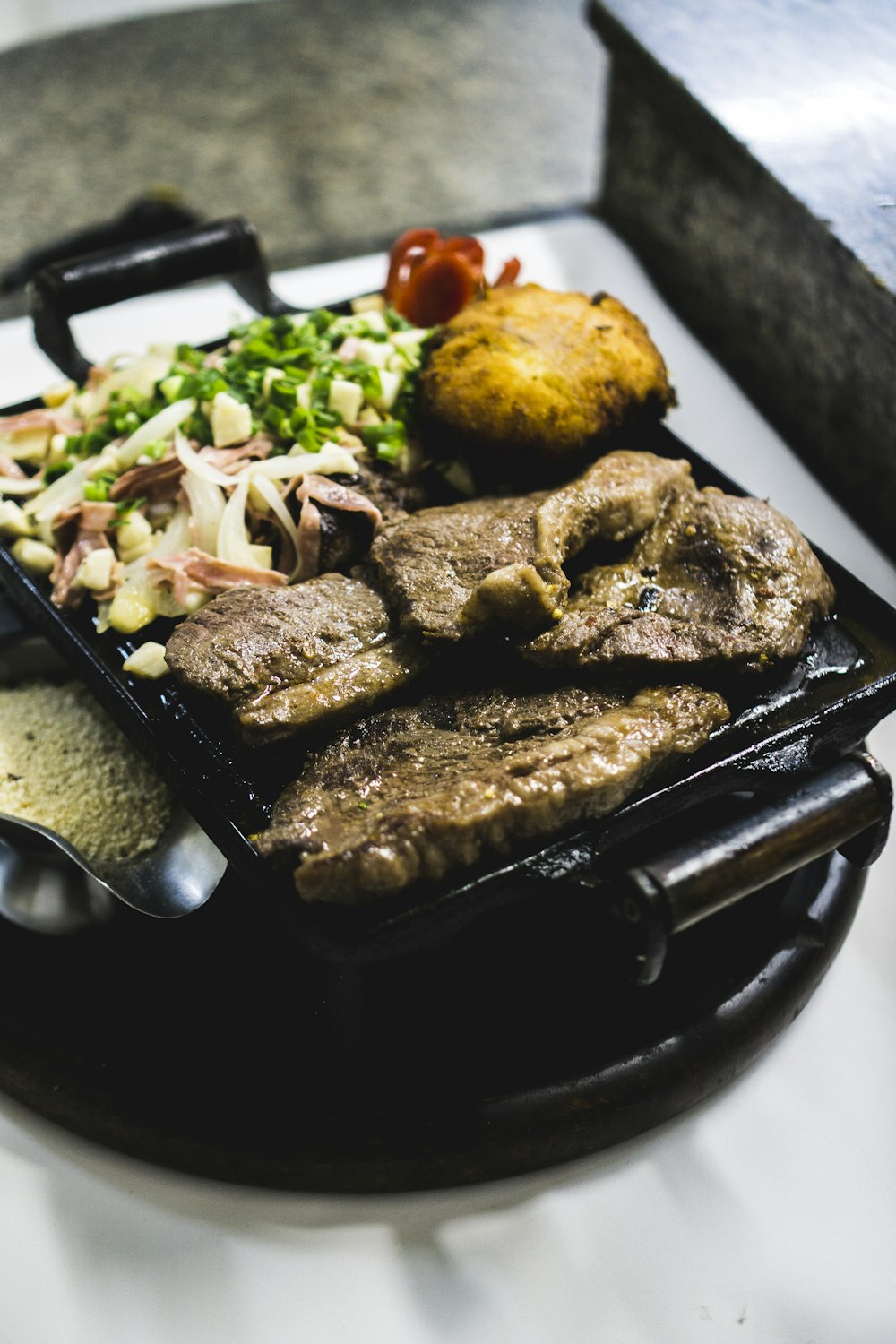 grilled meat on cast iron skillet