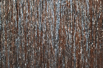 Bright copper sheets laid out flat, reflecting light in the factory.