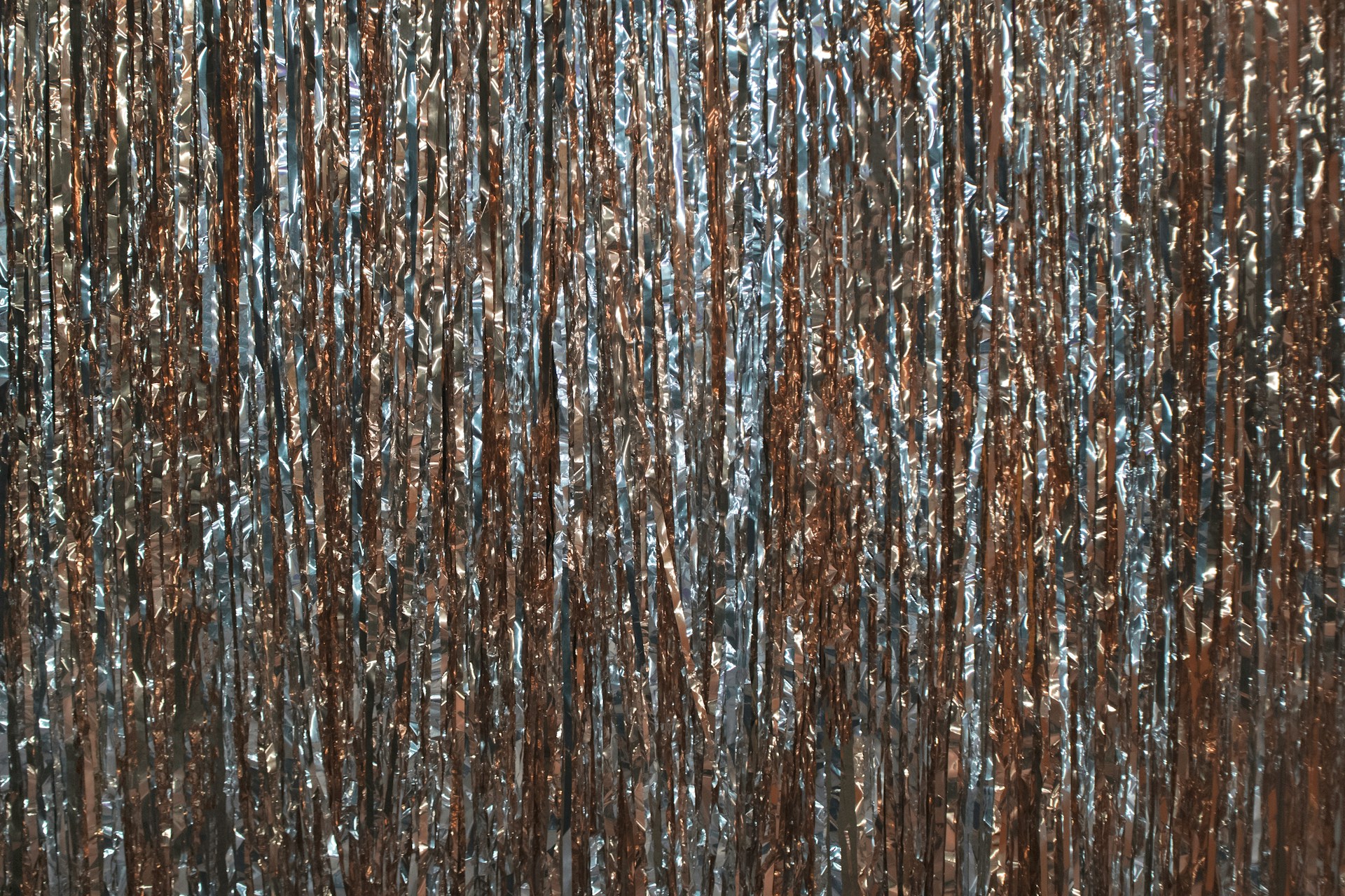 a close up of a curtain made of metallic foil