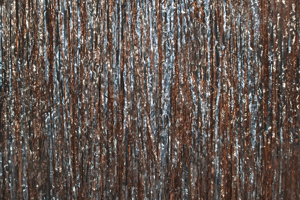 a close up of a curtain made of metallic foil
