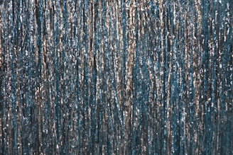 a blue curtain with silver foil on it