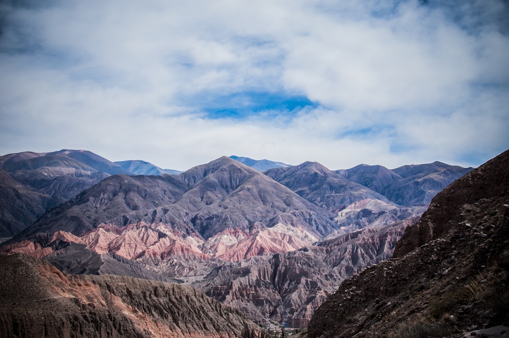 mountains under white clouds