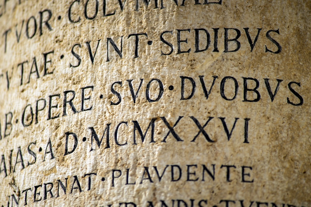 a close up of a stone with writing on it