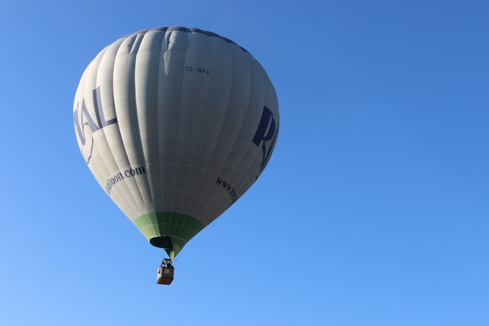 white-and-green hot air balloon during daytime