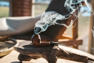 smoke coming from brown smoking pipe