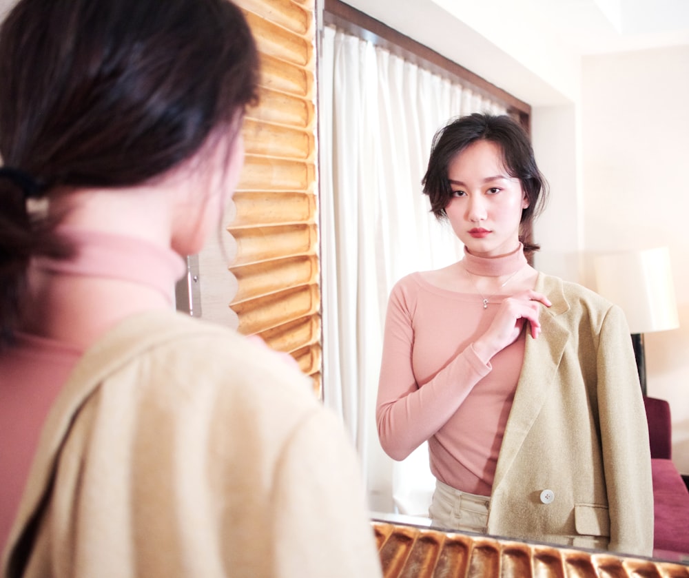 woman in pink long-sleeved shirt