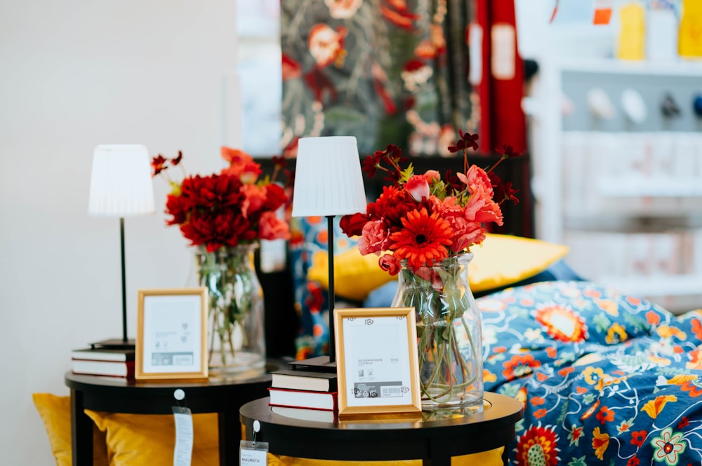 two flower arrangements on side tables