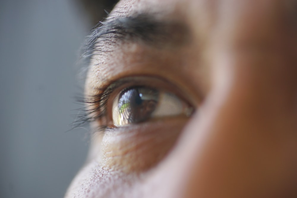 persons eye in close up photography