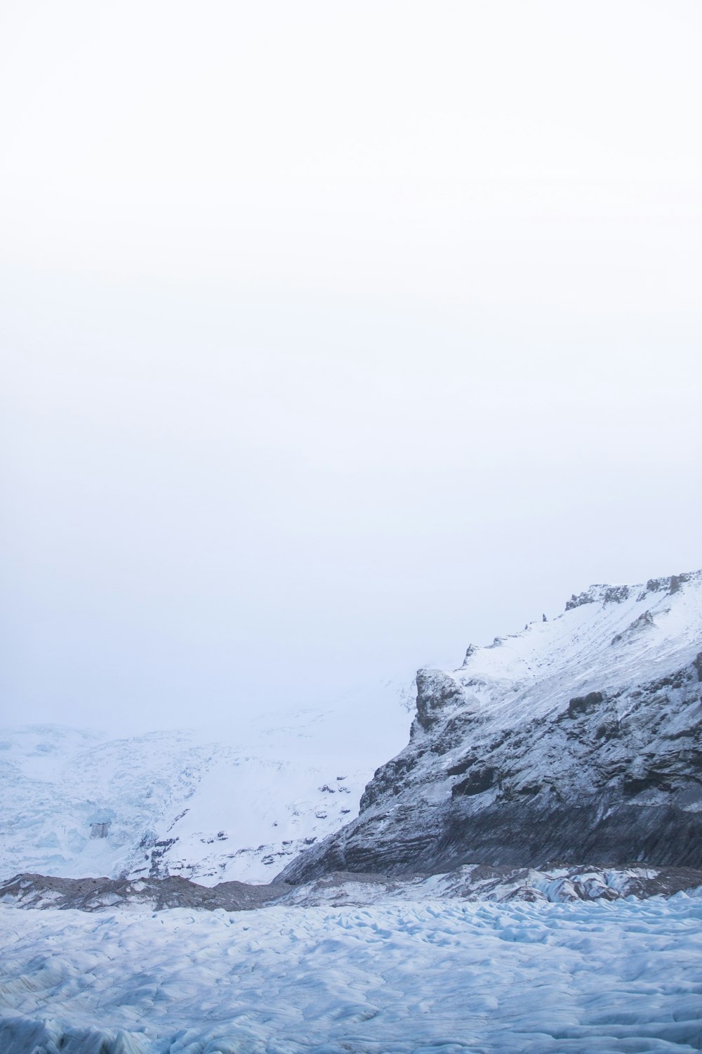 body of water and snow-covered mountain