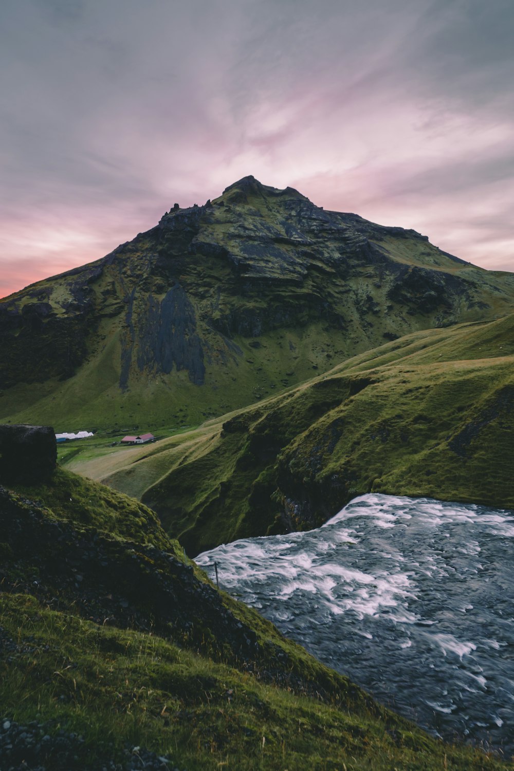 waterfalls between green mountains