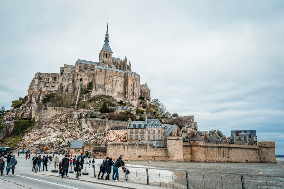 people walking near castle