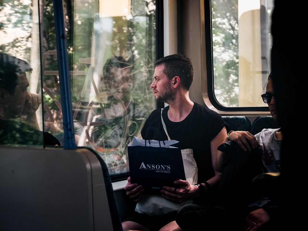 man sitting inside the bus