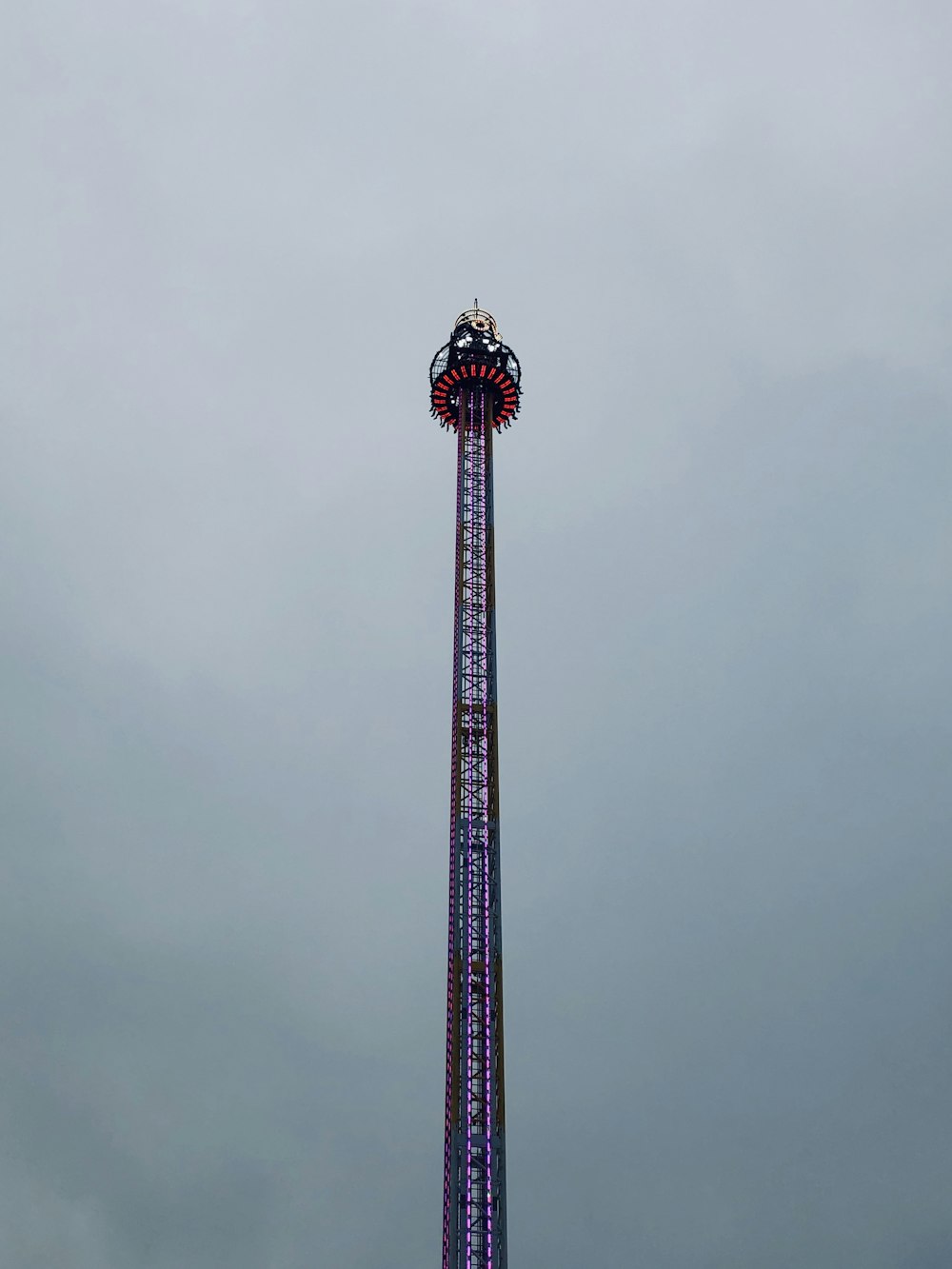 low-angle photography of purple tower during daytime