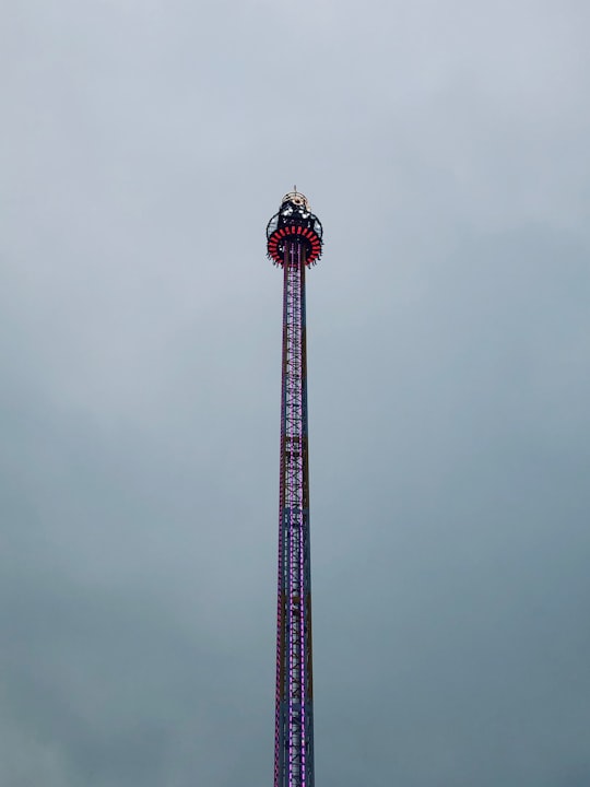 low-angle photography of purple tower during daytime in Hyde Park United Kingdom