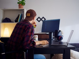 man in front of desktop
