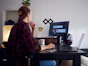 man sitting near table using computer