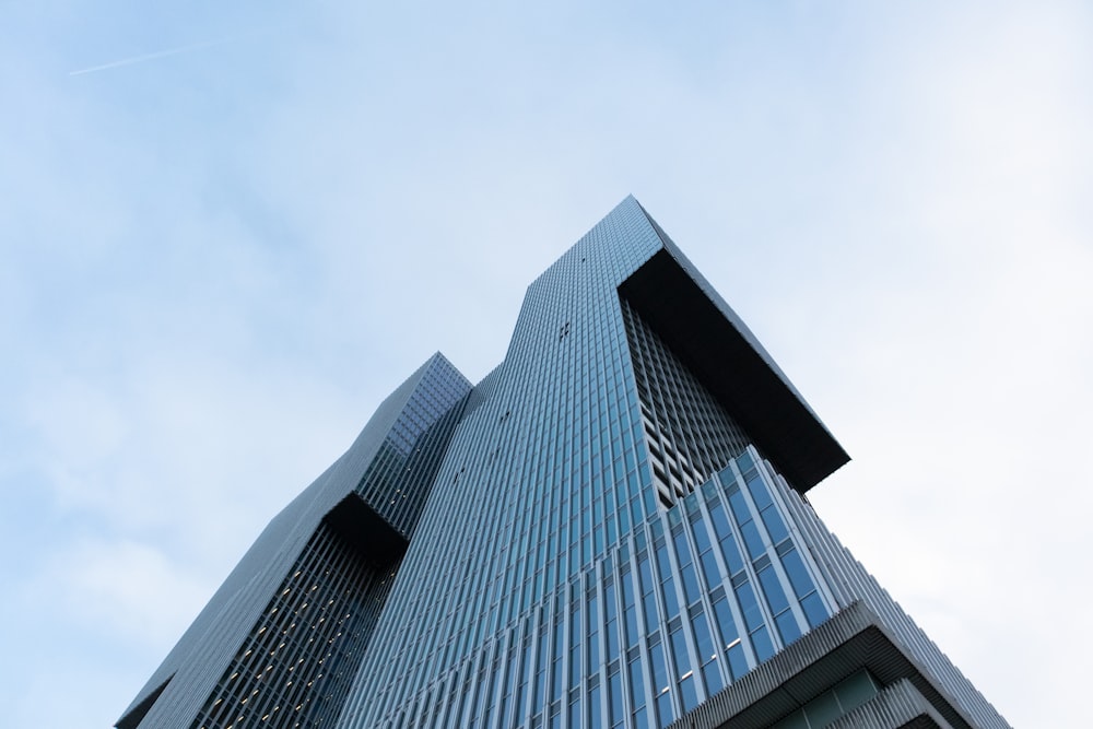 low-angle photography of curtain-wall high-rise building during daytime