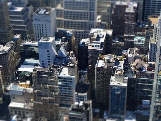 A high-angle view of a diverse urban skyline featuring various commercial and residential buildings.
