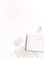 A lifestyle shot showing a relaxed moment with a vayuo2 oxygen can beside a book and a cup of tea.