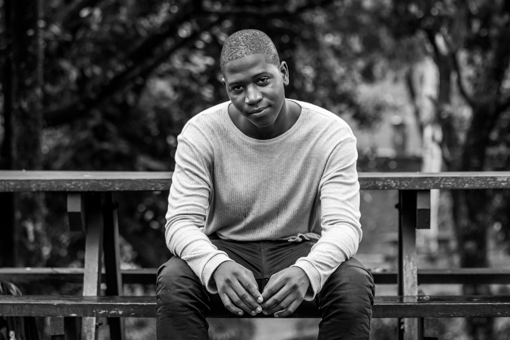 man sitting on bench during daytime