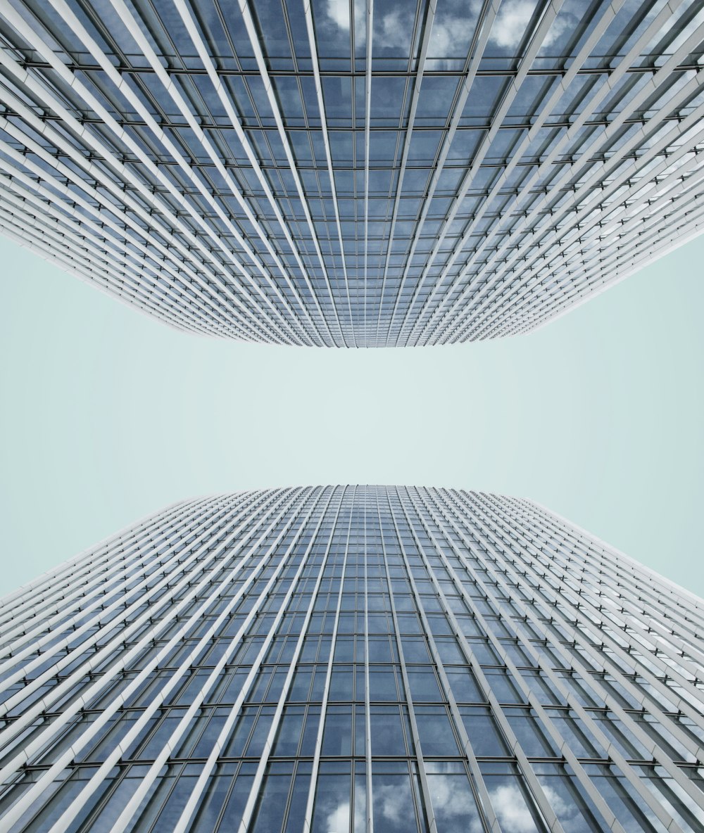 low angle photo of high rise glass building at daytime