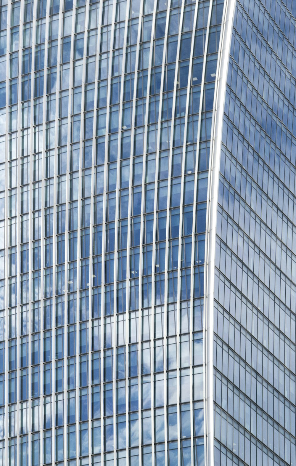 low-angle photography curtain-wall high-rise building during daytime