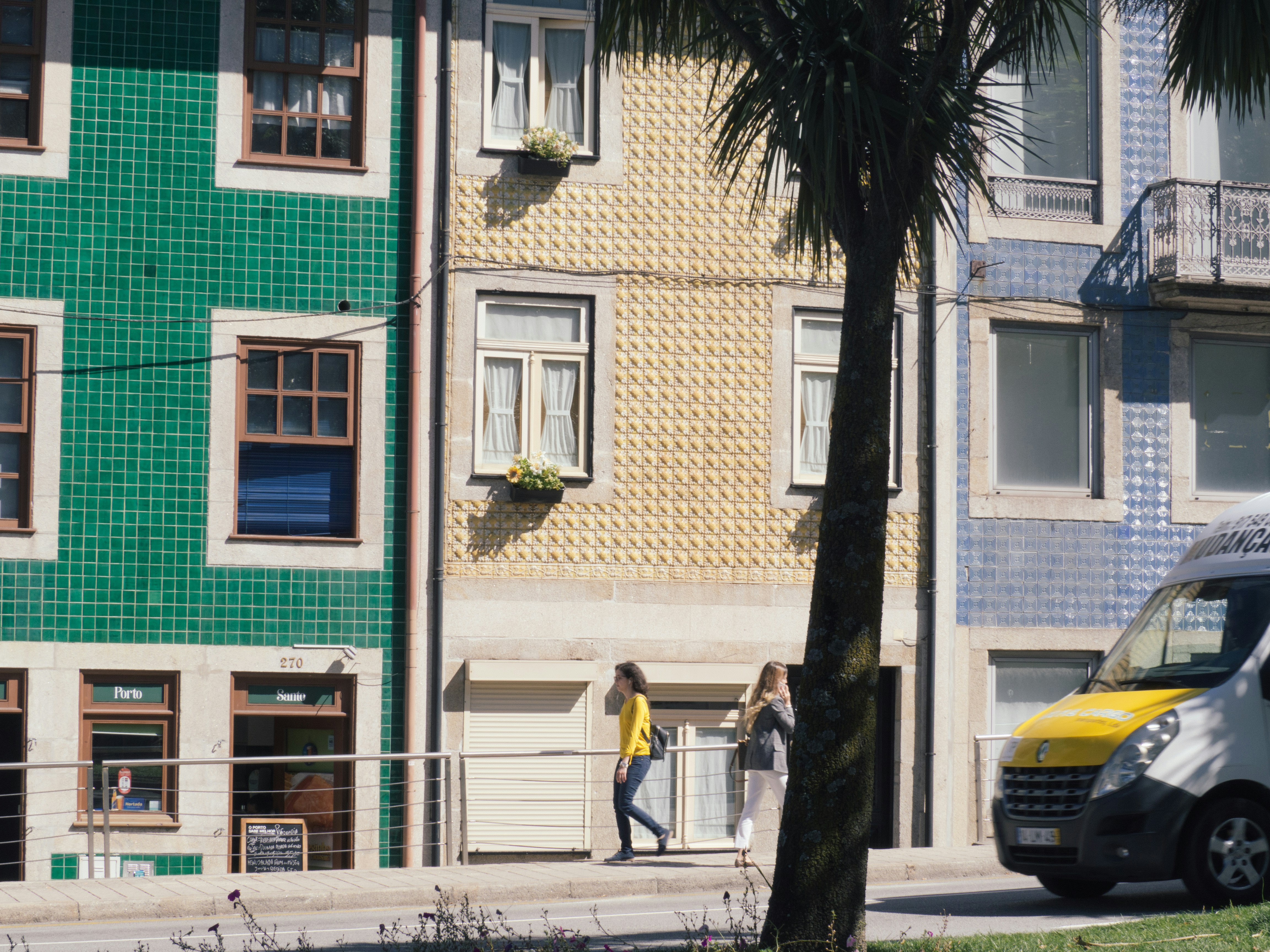 woman walking beside building