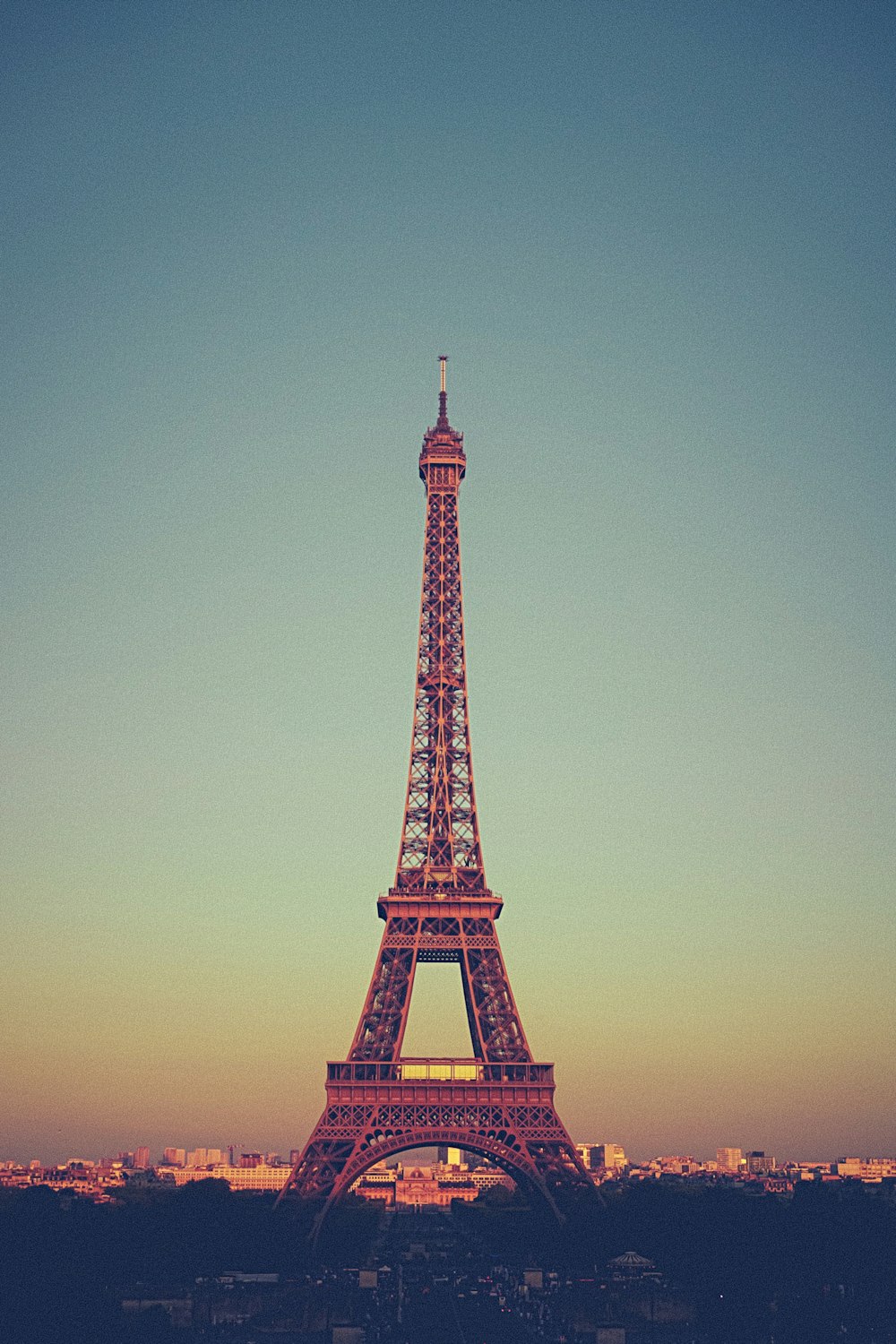 brown Eiffel tower under grey sky