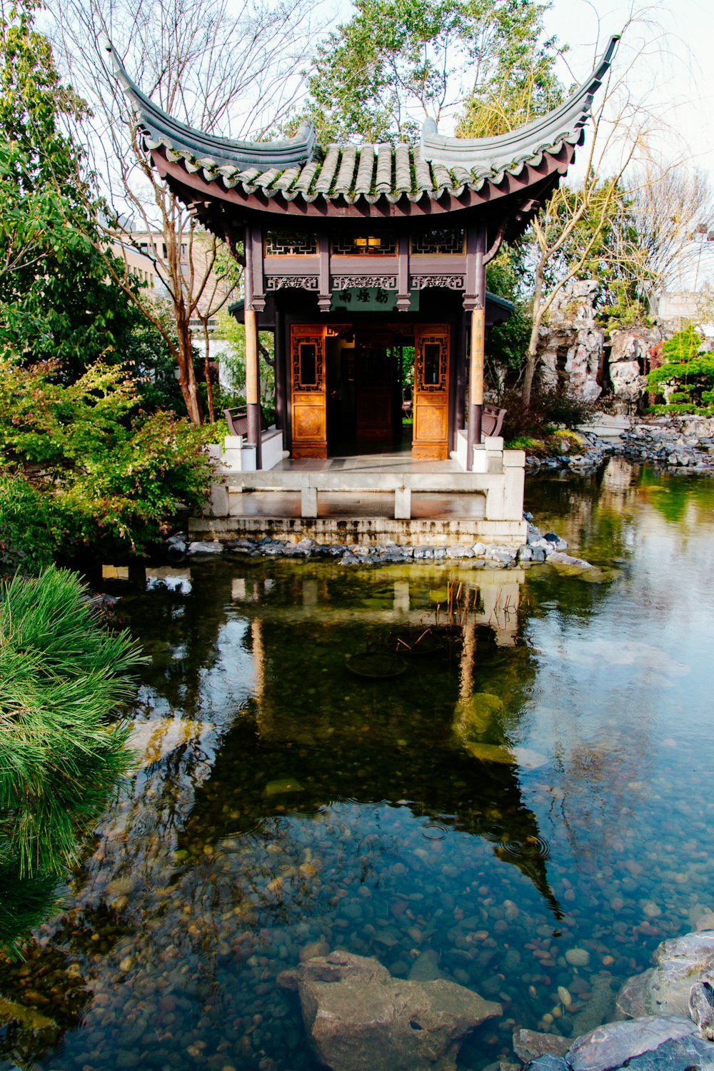 empty pagoda temple by body of water during daytime