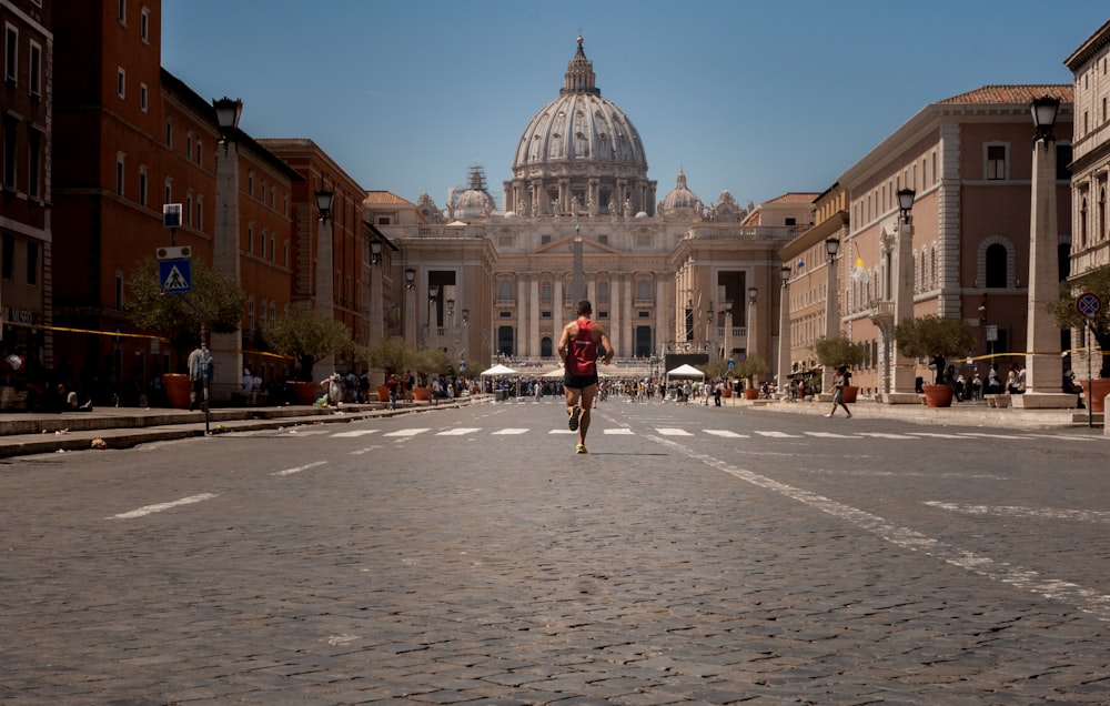 man running near concrete building