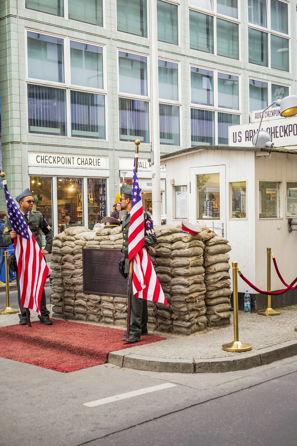 two soldiers holding USA flag standing