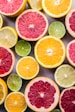 flat lay photography of sliced pomegranate, lime, and lemon