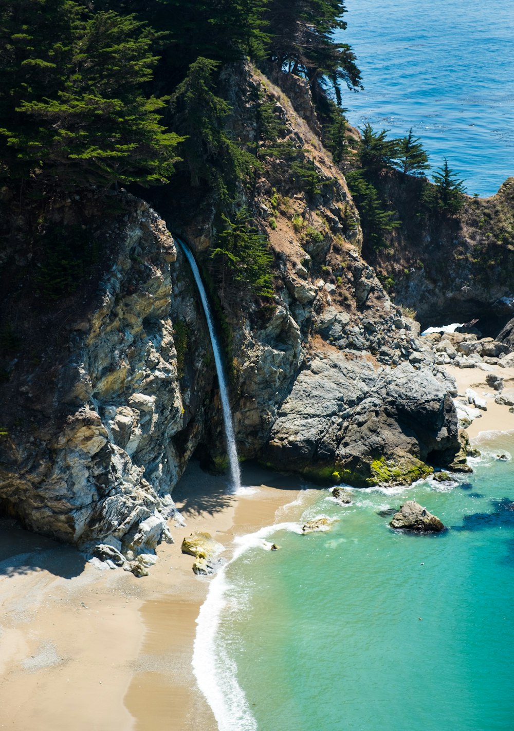 waterfalls beside sea