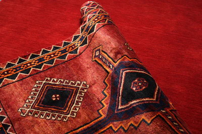 Rolled karandi fabric showcasing its rich weave and depth.