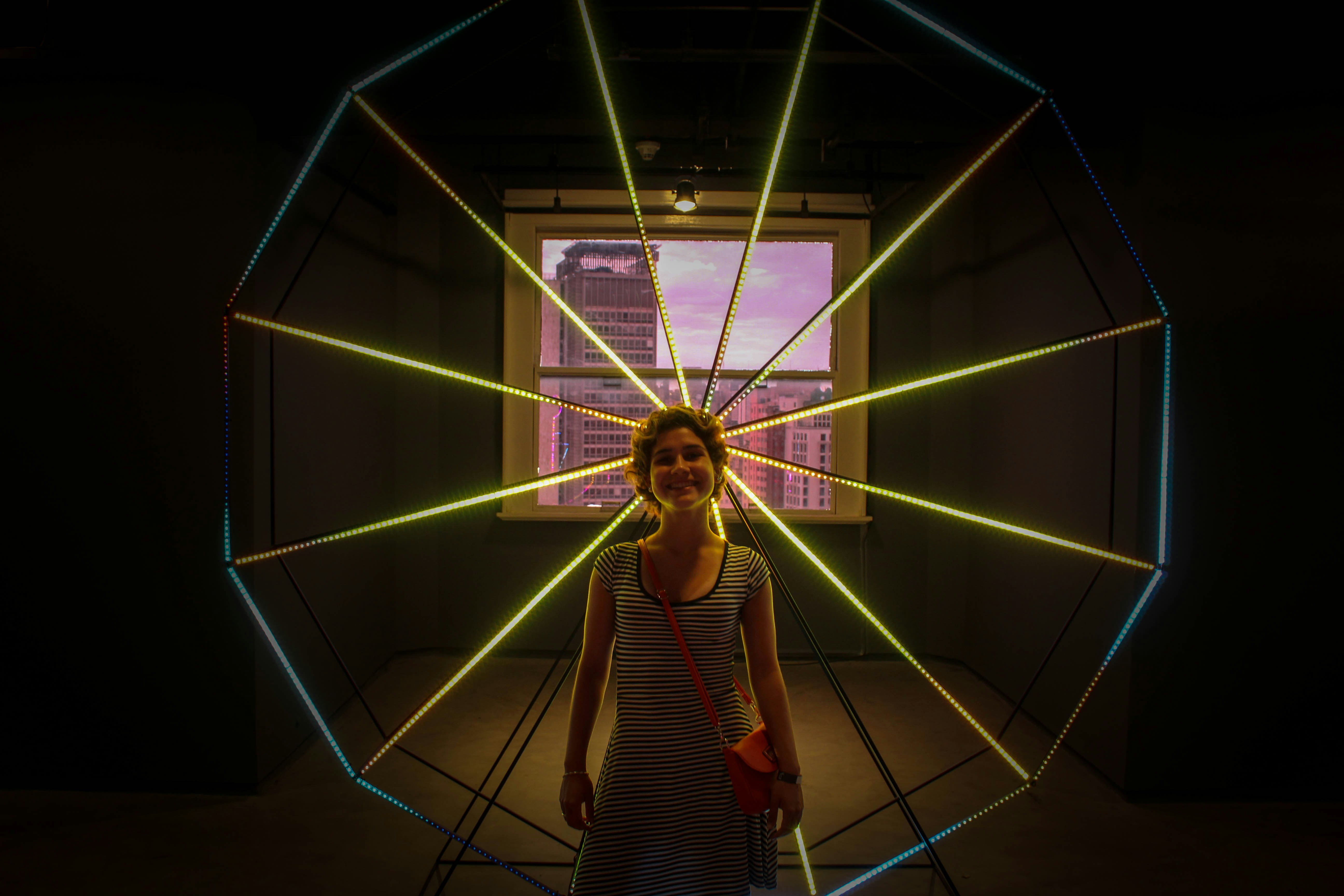 woman standing in front of lighted decor