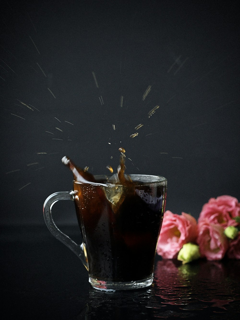 clear glass mug with black beverage