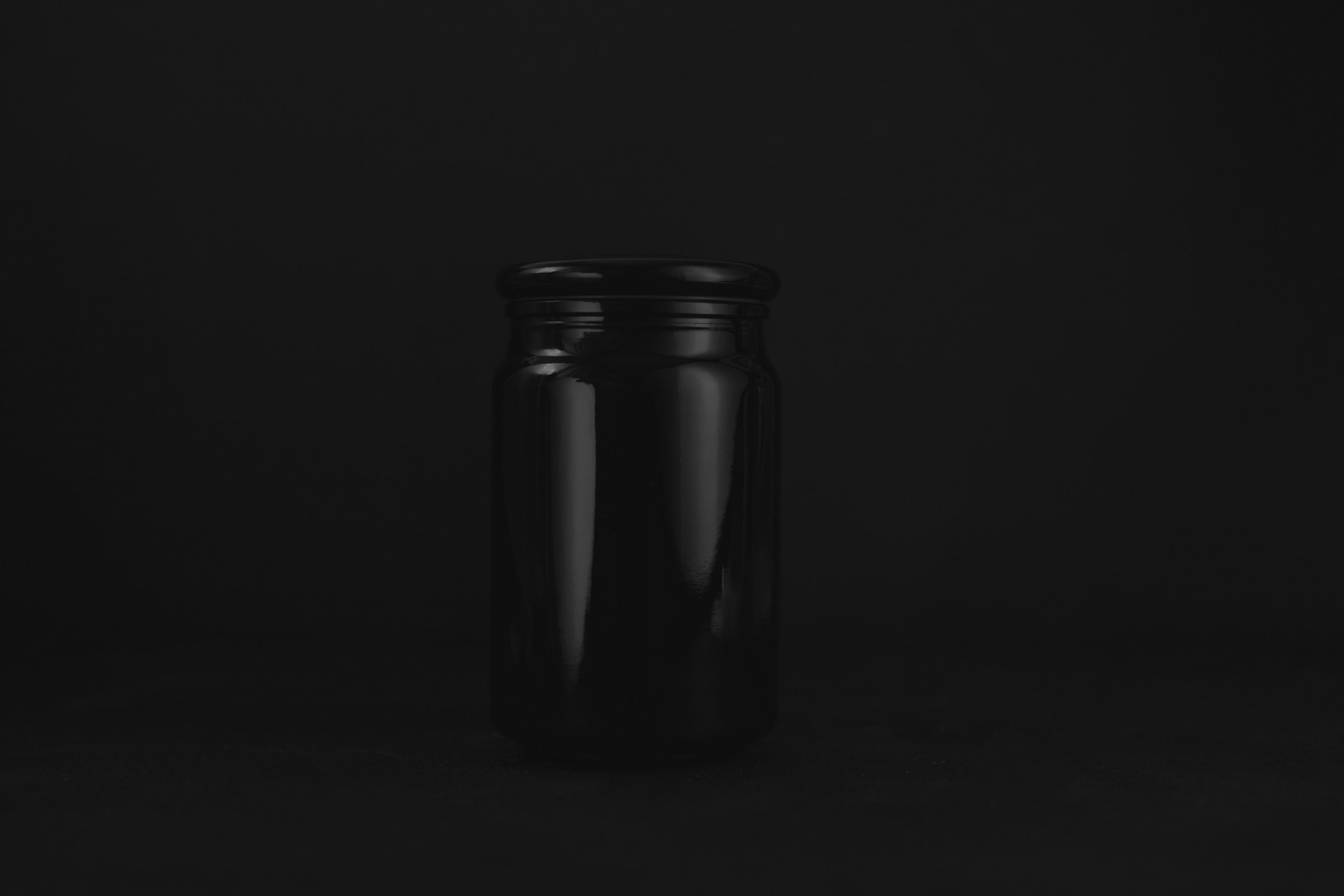 empty black glass jar