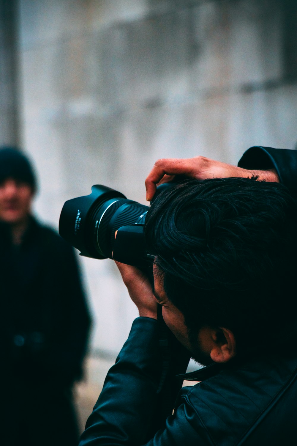 man holding DSLR camera