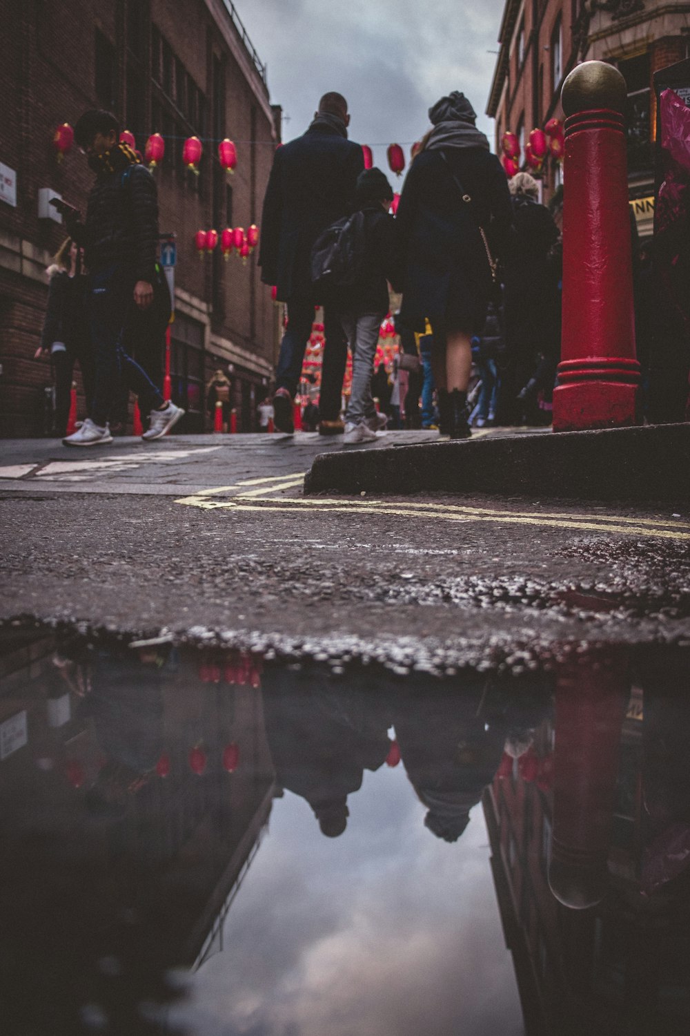 reflection of people on water during daytime