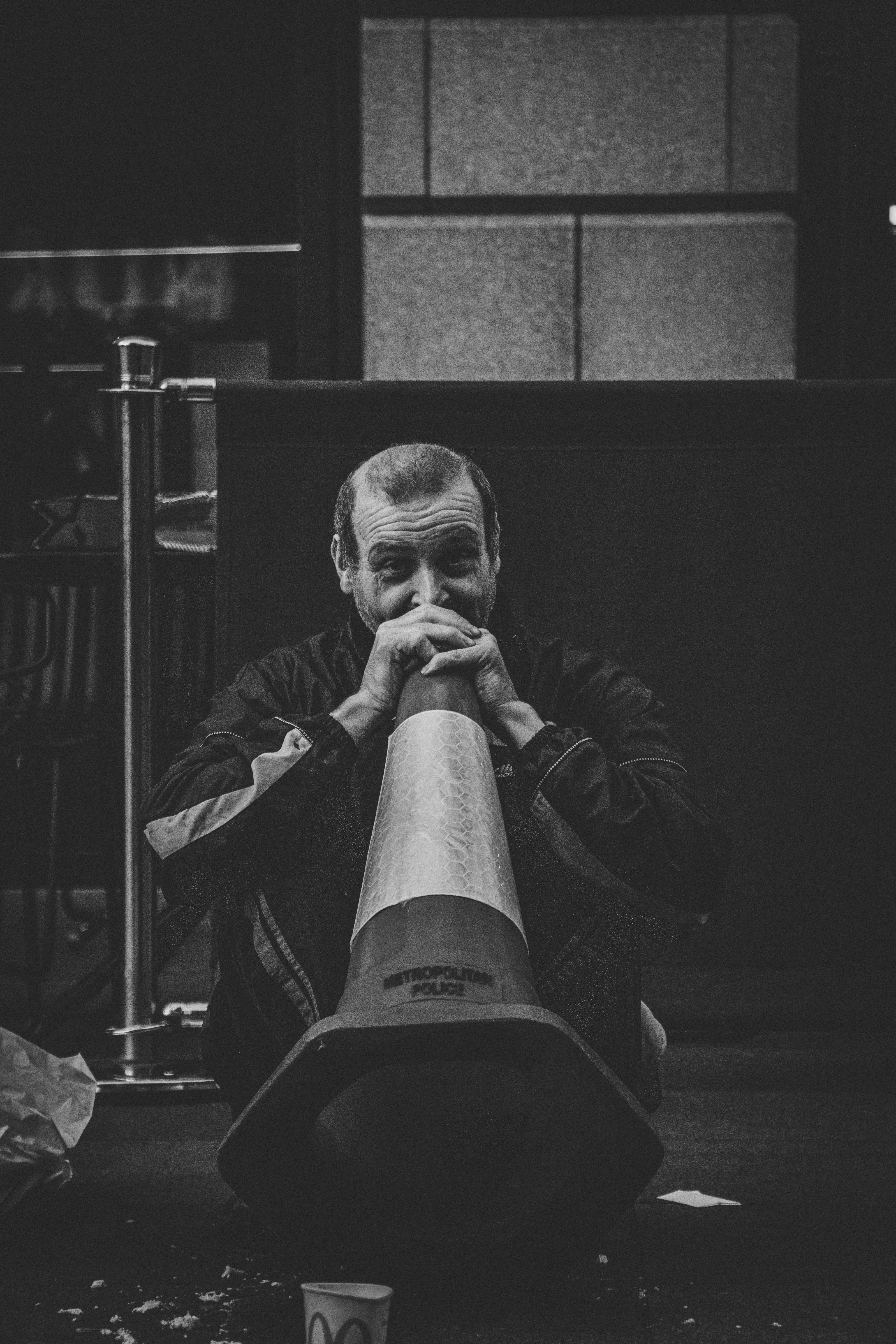 man holding traffic cone