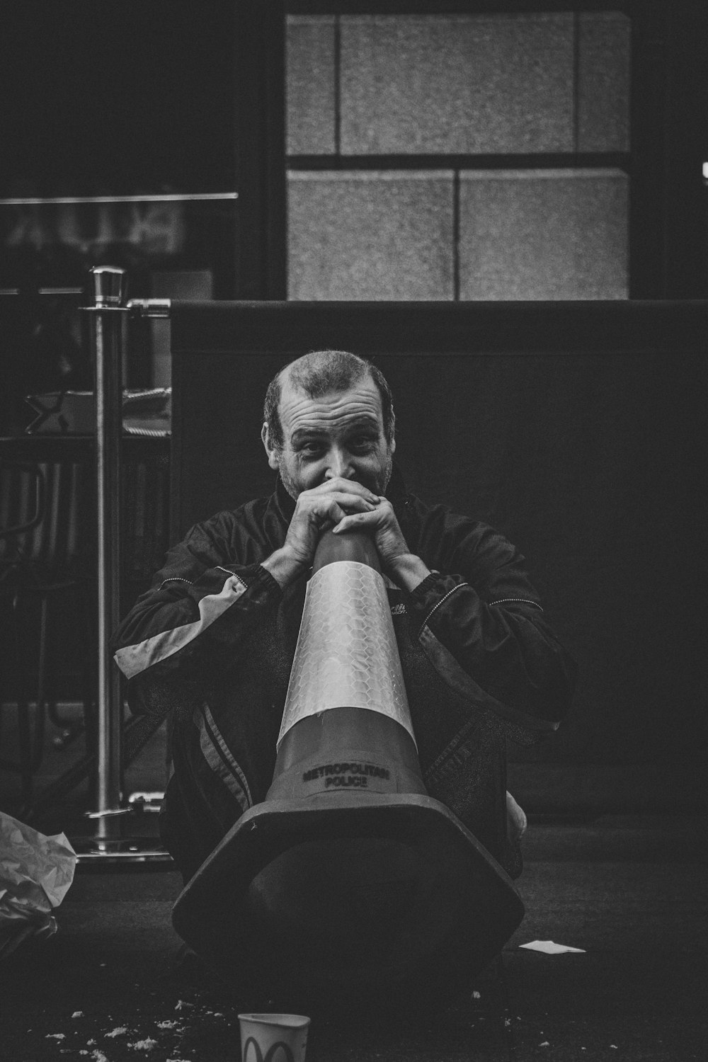 man holding traffic cone