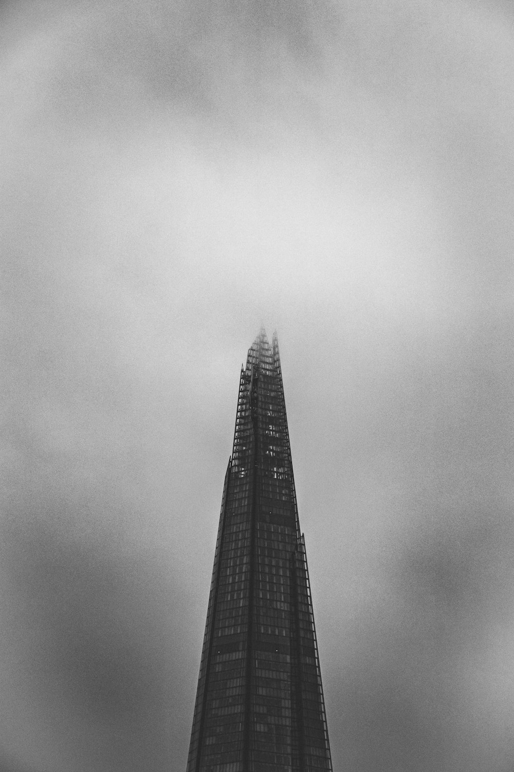 grayscale photography of high rise tower