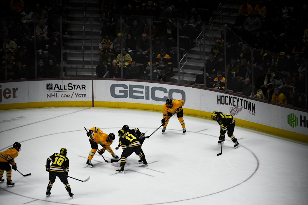 people playing hockey inside stadium