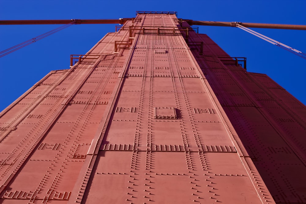 low-angle photography of red metal tower