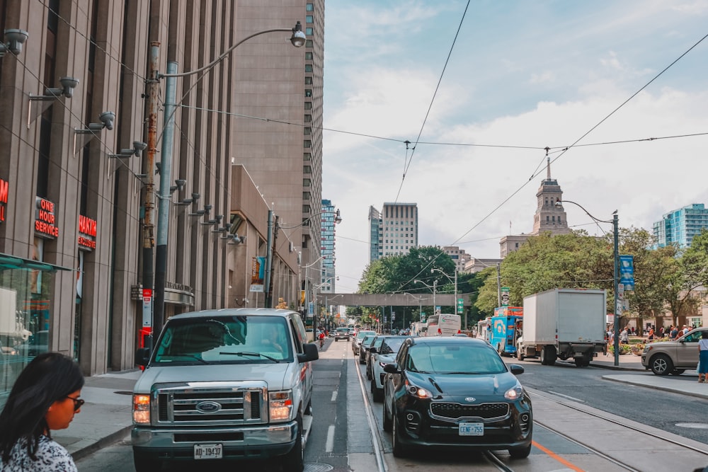 vehicles fall in line on road way during daytime