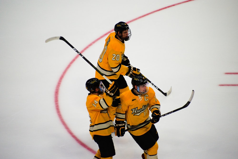 three hockey players on focus photography