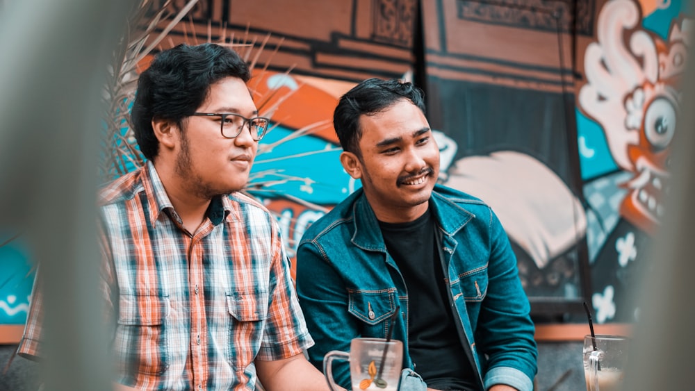 two man sitting on chair