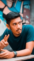 selective focus photography of man in green t-shirt