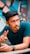 selective focus photography of man in green t-shirt